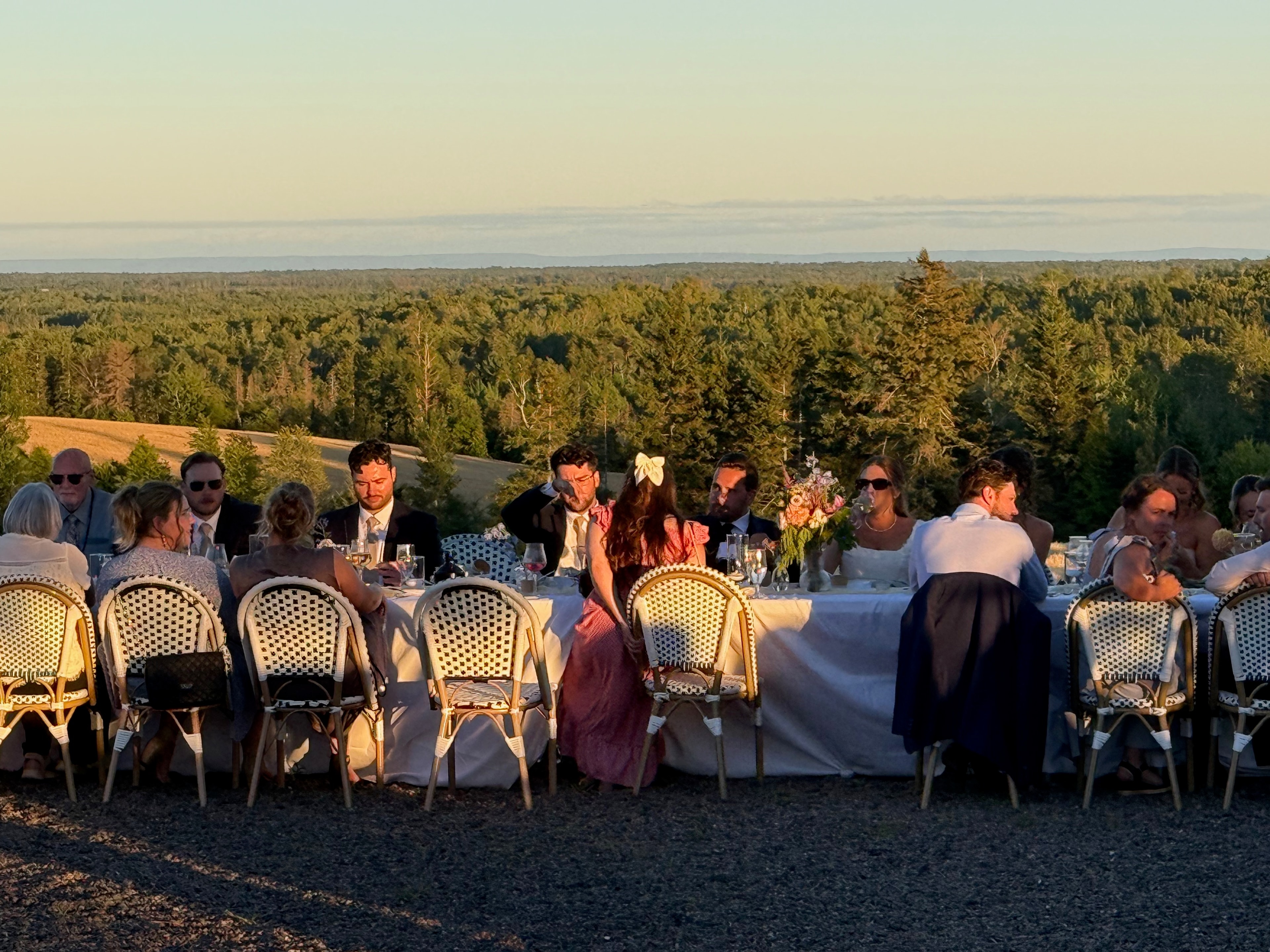 Guests mingling on the lawn at a Double Hill Cidery summer event